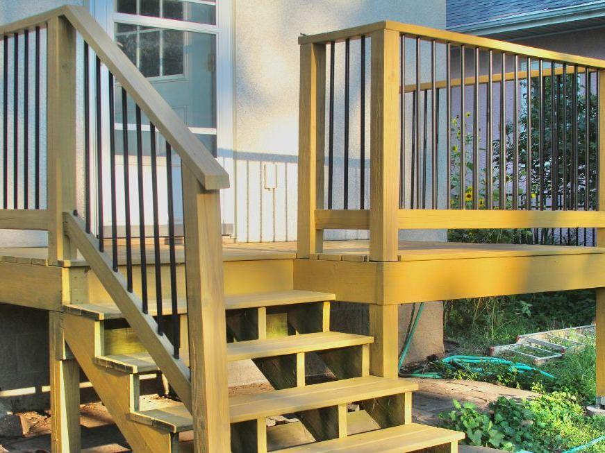 A deck we restored: boards, railings and stair treads stripped back and re-stained